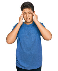 Poster - Teenager hispanic boy wearing casual clothes with hand on head for pain in head because stress. suffering migraine.