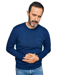 Sticker - Middle age hispanic man wearing casual clothes with hand on stomach because indigestion, painful illness feeling unwell. ache concept.