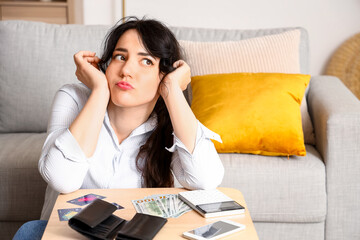 Young woman planning budget at home