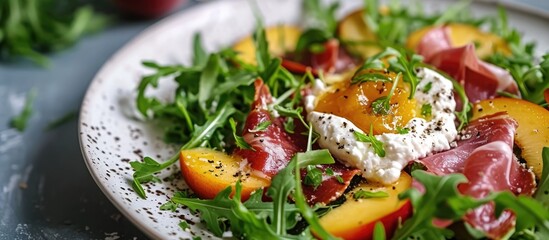 Wall Mural - Nourishing summer salad with peach, burrata, arugula, and jamon. Healthy cuisine.