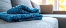 Microfiber Cloth Used For Cleaning Upholstery, Including Sofas And Other Fabric Surfaces, Offered By A Professional Cleaning Service.