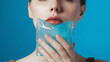 © Dennis - A person holding an ice pack to a bruised jaw. Copy Space