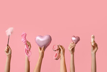 Many Female Hands With Heart Shaped Balloons And Sex Toys On Pink Background. Valentine's Day Celebration