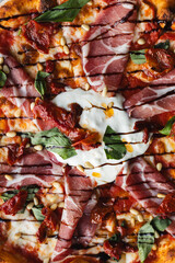 Wall Mural - Appetizing pizza with tomato sauce, meat, basil and cheese.