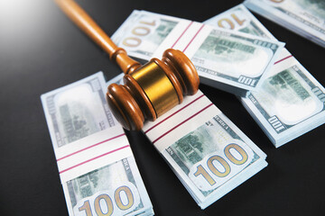 Wall Mural - Gavel and dollars banknotes on table