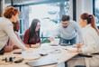 © qunica.com - Successful multicultural business team collaborate for successful project achievement.