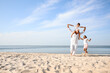 © New Africa - Cute little children with grandfather spending time together on sea beach