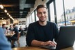 © Portrait Studio - a remote worker at a cafe, enjoying work life balance and working hard