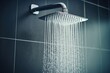 Close up of water flowing from a modern chrome shower head in a modern bathroom