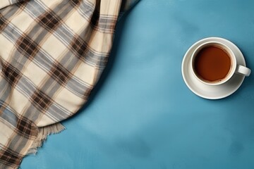 Sticker - Coffee and warm plaid on light blue background text space flat lay composition