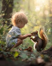 A Little Child Feeds A Squirrel With A Nut. Cute Little Boy Feeding Squirrel At Summer Park