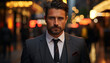 © Jemastock - Confident businessman in suit, looking at camera outdoors generated by AI