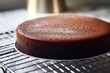 Freshly baked homemade chocolate chiffon cake on white table Fluffy moist and rich Using cooking utensils