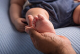 Fototapeta  - Newborn soft baby feet body part delicate motherhood 