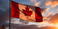 The Canadian Flag Flutters High. Blue Sky Background..