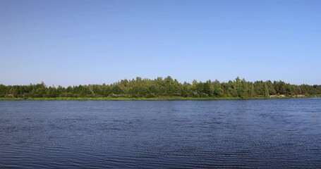 Wall Mural - river,   water with waves in the river with green grass growing on the river bank