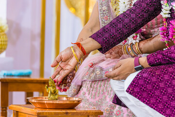 Canvas Print - Indian Hindu wedding ceremony Ganesh pooja ritual close up