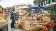 © Gorodenkoff - Multiethnic Small Business Owners Selling a Selection of Ecological Fruits and Vegetables at an Outdoors Farmers Market. Customers Walking Around the Square, Shopping for Fresh Organic Farm Produce