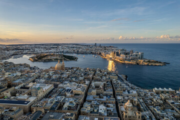 Wall Mural - Aerial beautiful drone view of sunset in Valletta old harbour, Malta