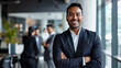© Farnaces - Portrait of a handsome smiling asian indian businessman boss standing in his modern business company office.