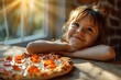 A young girl with a freshly baked pizza on a table