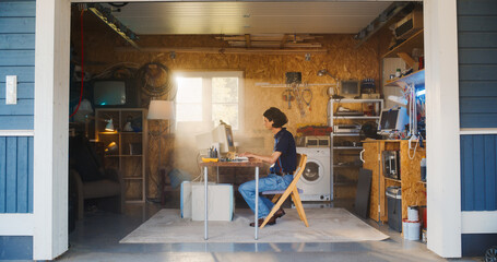 Leinwandbilder - Caucasian Male Software Engineer Programming On Old Desktop Computer In Retro Garage With Random Appliances. Man Working On Innovative Fintech Startup Company In Nineties. Nostalgia Concept.