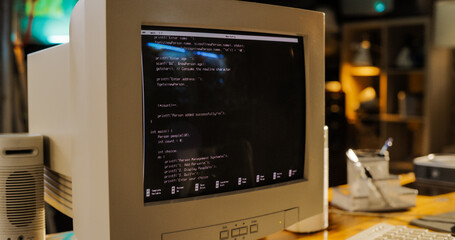 Leinwandbilder - Close Up Shot Of Old Desktop Computer On Work Desk Of Software Developer In Retro Garage. Dated PC Has Operating System Terminal Opened, Prompts Running On Screen, Code Functioning Successfully.