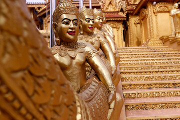 Wall Mural - Mongkol Serei Kien Khleang Pagoda.  Staircase decorated with golden Buddhist statues. Phnom Penh; Cambodia.