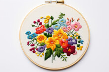 
Illustration Of Simple Cross Stitch Embroidery Depicting A Small, Colorful Flower Bouquet On A White Canvas