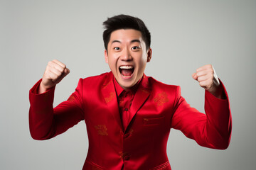 Wall Mural - chinese cheerful man wearing traditional red suit