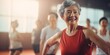 © xartproduction - An elderly Asian Woman is exercising in studio