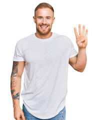 Wall Mural - Young irish man wearing casual clothes showing and pointing up with fingers number four while smiling confident and happy.