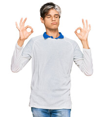 Sticker - Young hispanic man wearing casual clothes relax and smiling with eyes closed doing meditation gesture with fingers. yoga concept.