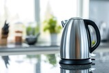 Fototapeta Natura - A modern electric kettle, isolated on a kitchen counter background