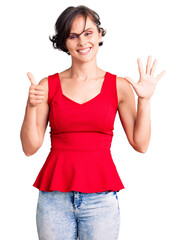 Poster - Beautiful young woman with short hair wearing casual style with sleeveless shirt showing and pointing up with fingers number six while smiling confident and happy.