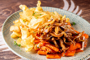 Poster - appetizer pig pork ears with potato chips and carrot