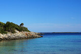 Fototapeta Natura - Natural landscape of Playa de Cavalleria (Mercadal) in Minorca beach with clear blue sky and rocky seashore- Menorca, Spain