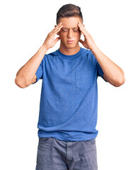 Wall Mural - Young handsome hispanic man wearing casual clothes suffering from headache desperate and stressed because pain and migraine. hands on head.