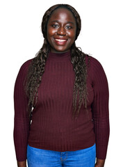 Poster - Young african woman wearing casual winter sweater with a happy and cool smile on face. lucky person.