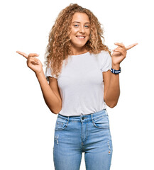 Sticker - Beautiful caucasian teenager girl wearing casual white tshirt smiling confident pointing with fingers to different directions. copy space for advertisement