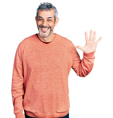 Wall Mural - Middle age hispanic with grey hair wearing casual sweater showing and pointing up with fingers number five while smiling confident and happy.