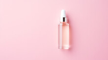 Cosmetic Serum On Pink Background Top View. Space