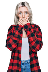 Sticker - Young blonde girl wearing casual clothes shocked covering mouth with hands for mistake. secret concept.