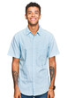 © Krakenimages.com - Young handsome african american man wearing casual clothes with a happy and cool smile on face. lucky person.