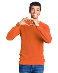 Poster - Young african amercian man wearing casual clothes smiling in love showing heart symbol and shape with hands. romantic concept.