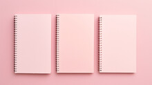 Different Notebooks On Light Pink Background Top View