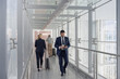 © ReeldealHD images - Business executives walking through airport terminal