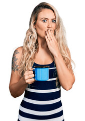 Sticker - Young blonde woman drinking a cup of coffee covering mouth with hand, shocked and afraid for mistake. surprised expression