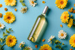  A bottle of wine in  flowers, on a blue background in pastel colors. Top view with a meta place for text. Advertising photo.