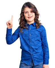 Cute child with long hair wearing casual clothes showing and pointing up with finger number one while smiling confident and happy.